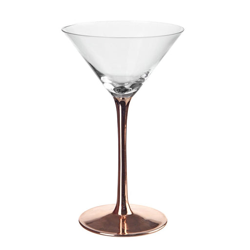 Clear martini glass with copper stem on white background