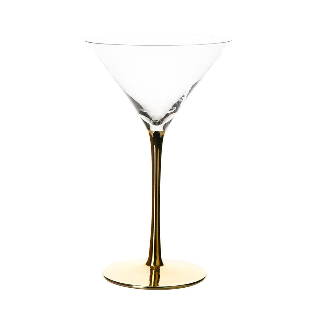 clear martini glass with gold stem on white background